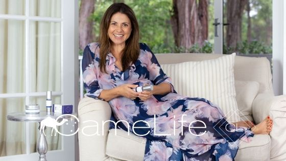 Image of Marie Patane holding a CameLife Restorative Serum  